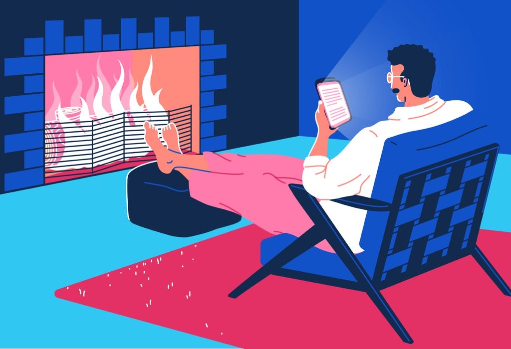 mixkit-man-sitting-in-front-of-a-fire-reading-from-a-66-original-large.jpg